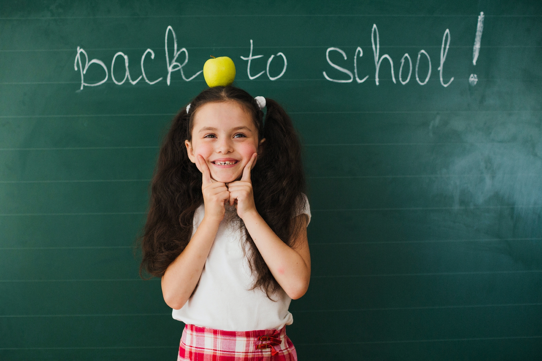 kid with apple on hers head