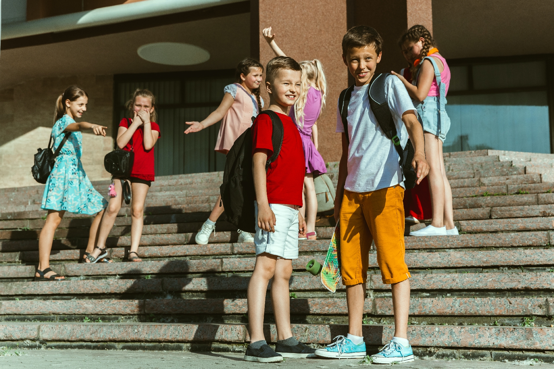 kids hanging in front of school