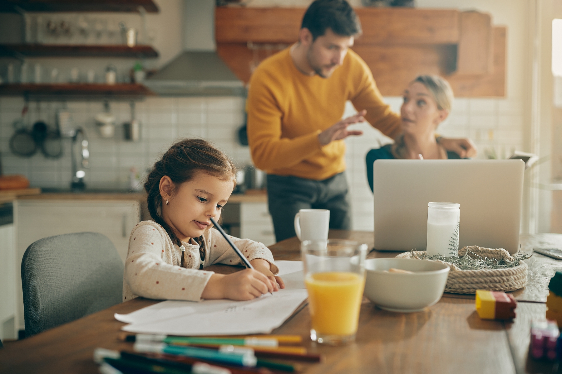 parents working while kid does homework