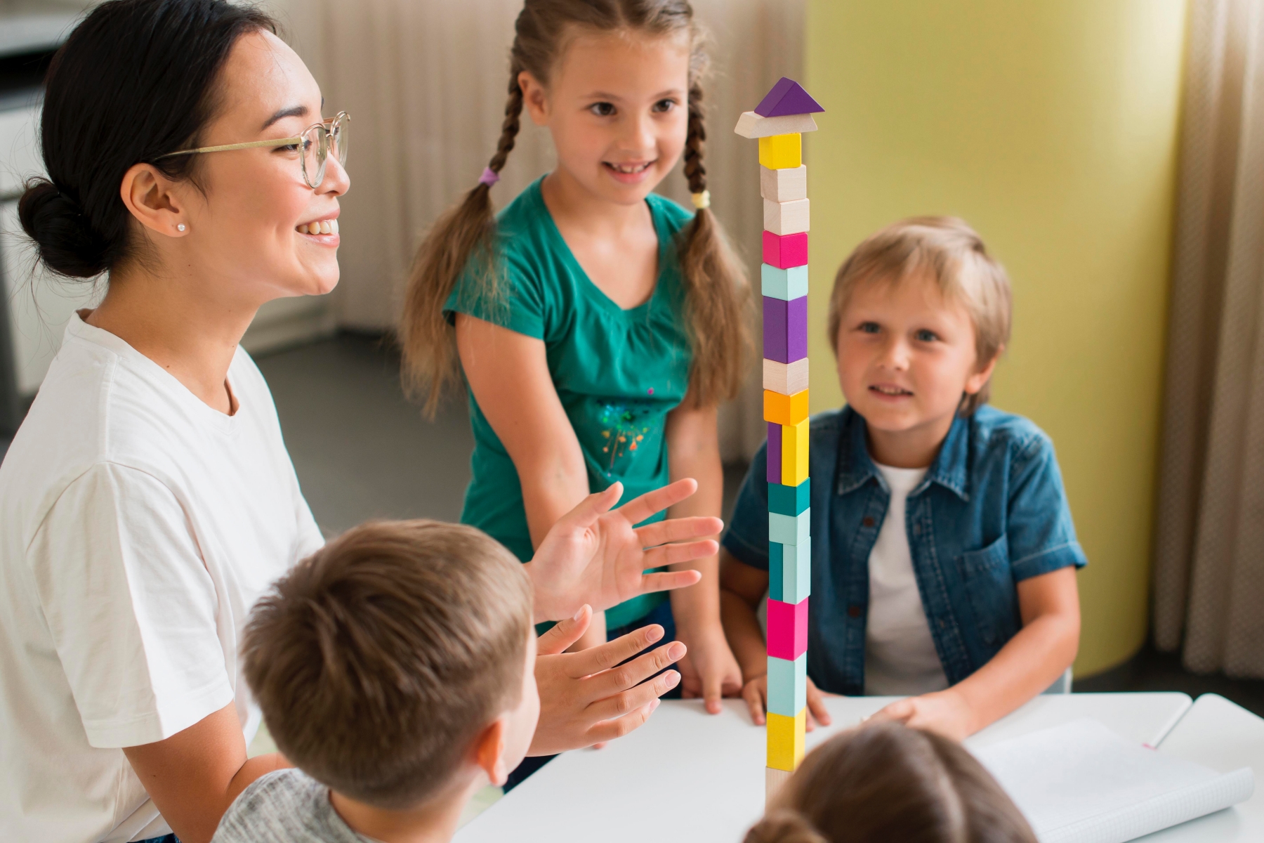 whole family playing with wooden toys